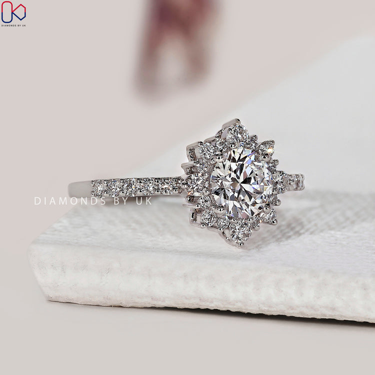 Pave setting ring with sparkling diamonds around the centre stone.
