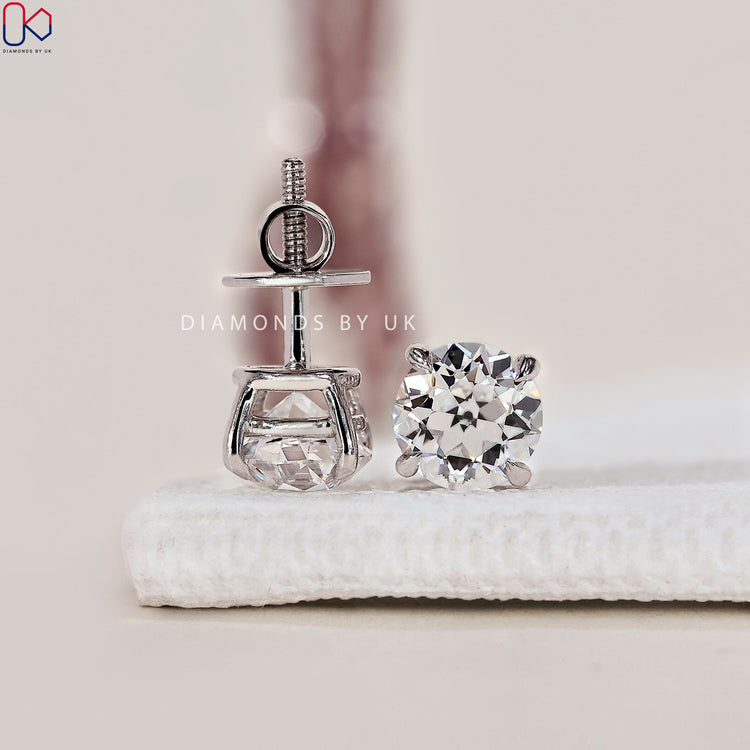Old European cut diamond earrings with vintage charm.
