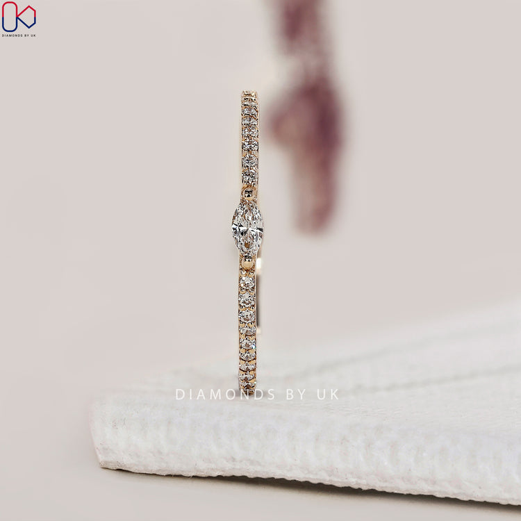 Prong set band featuring sparkling round cut diamonds.
