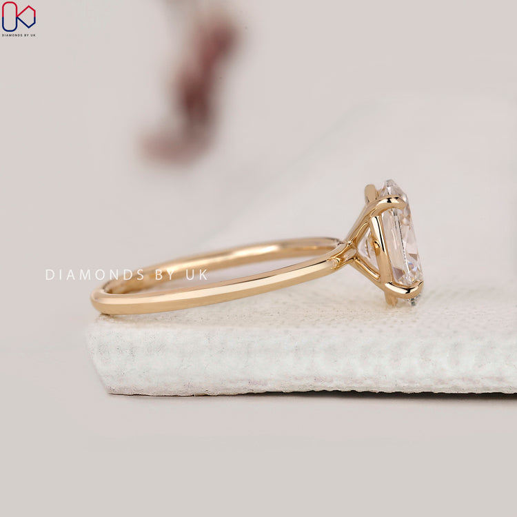 Simple engagement ring with handmade yellow gold band.
