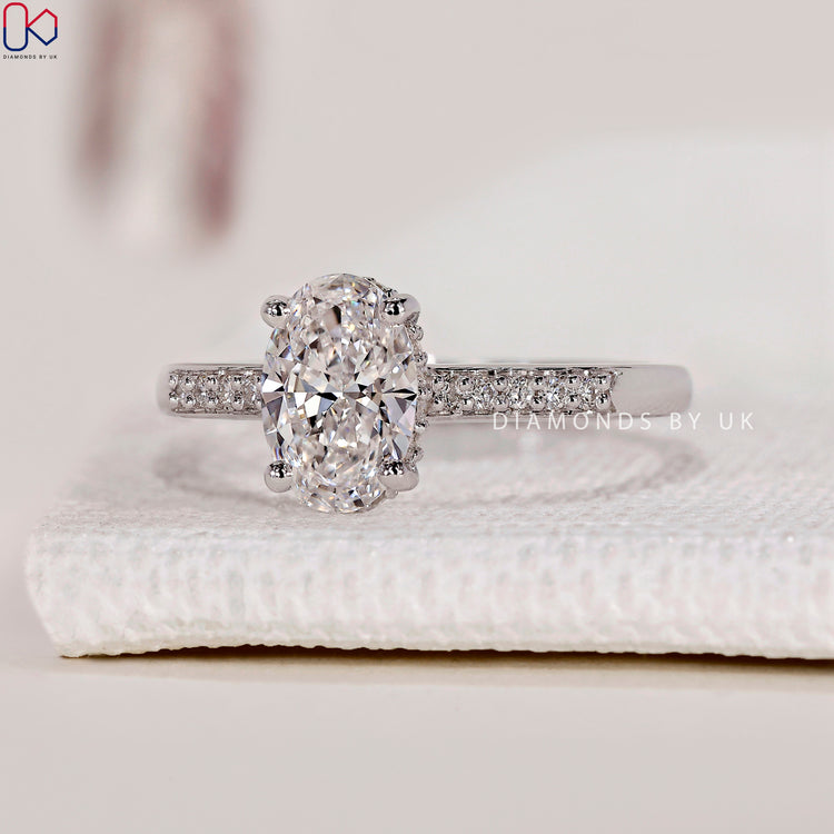 Prong setting ring with an oval cut ring for secure stone placement.