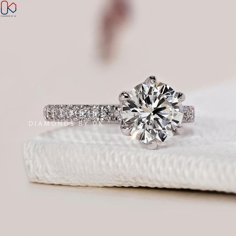 Tulip basket ring with a six-prong claw setting.
