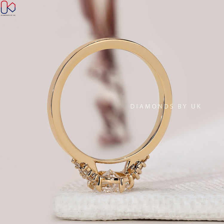 Buy engagement ring with oval shape and round accents.
