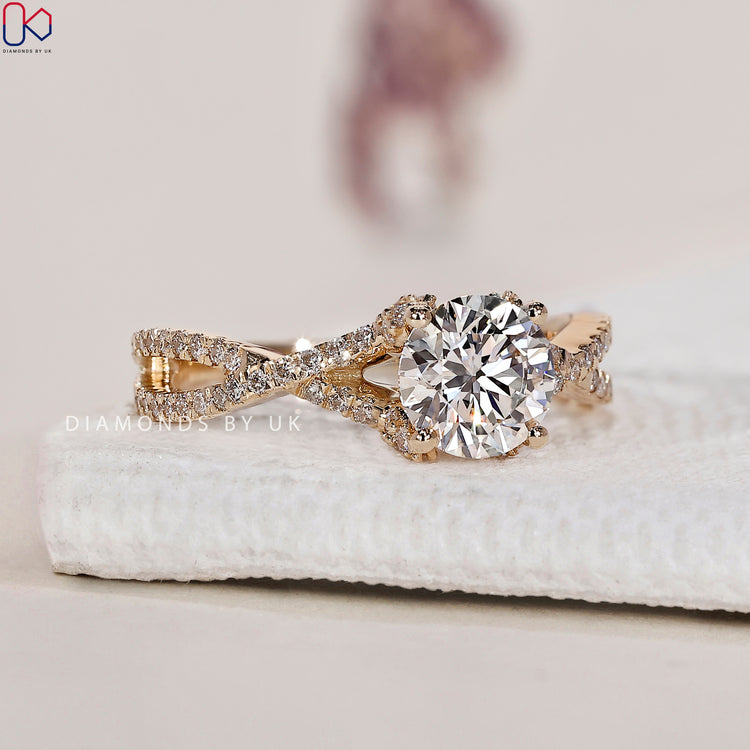 Twisted pave ring with a captivating design and side stone engagement ring accents.