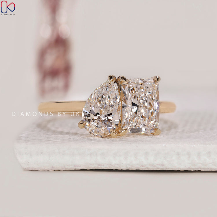 Pear cut engagement ring in yellow gold setting.
