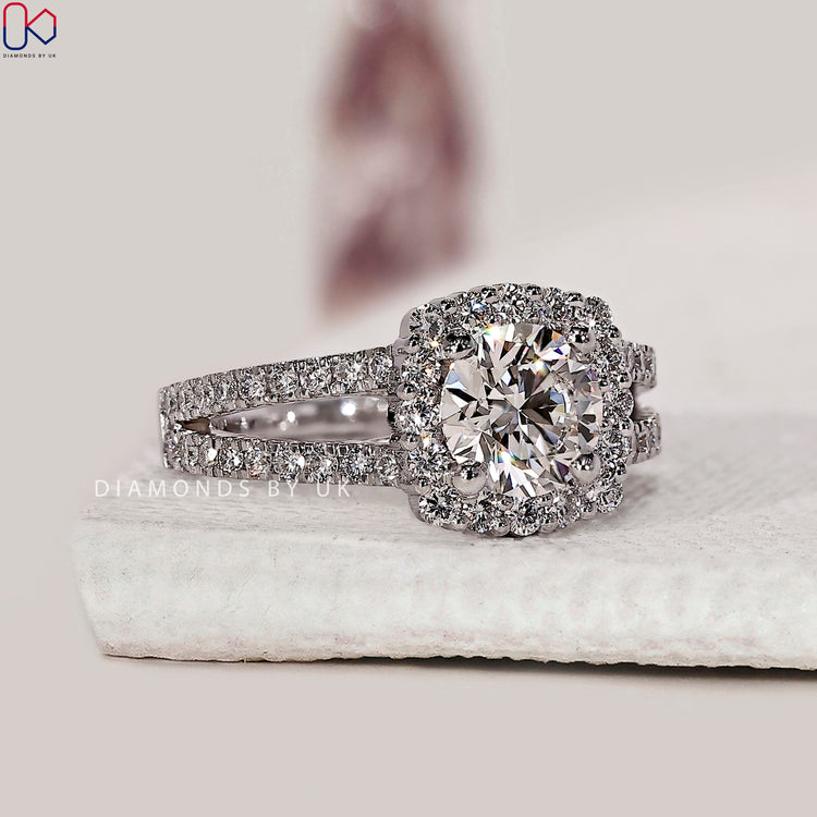 4 prong setting ring with round diamond halo.
