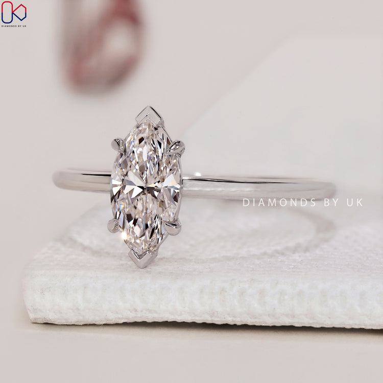 Handmade jewellery with a radiant Marquise diamond ring and a v shaped prong setting.
