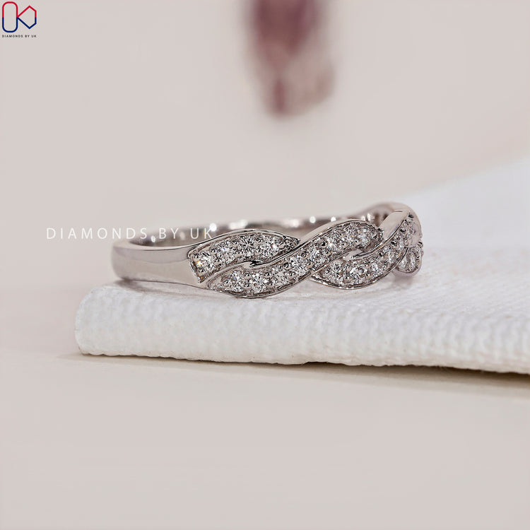 Diamondsbyuk wedding band with sparkling diamonds and elegant settings.
