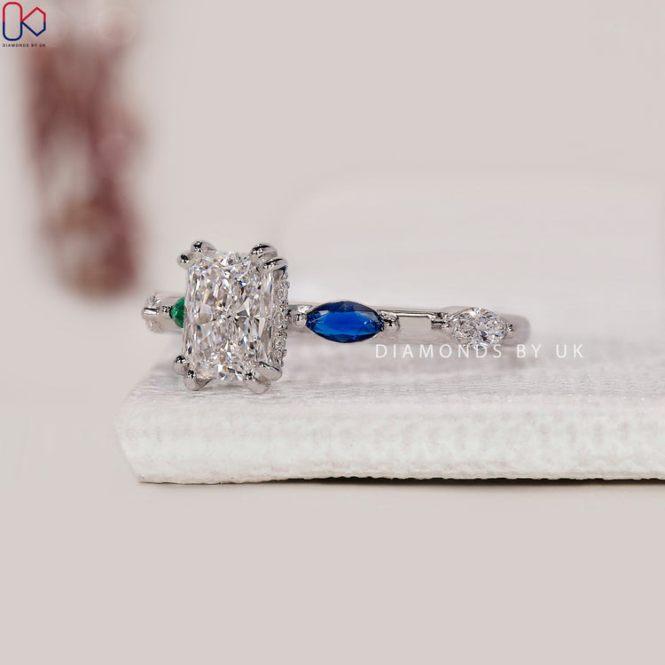 Double claw prong engagement ring with radiant cut center.

