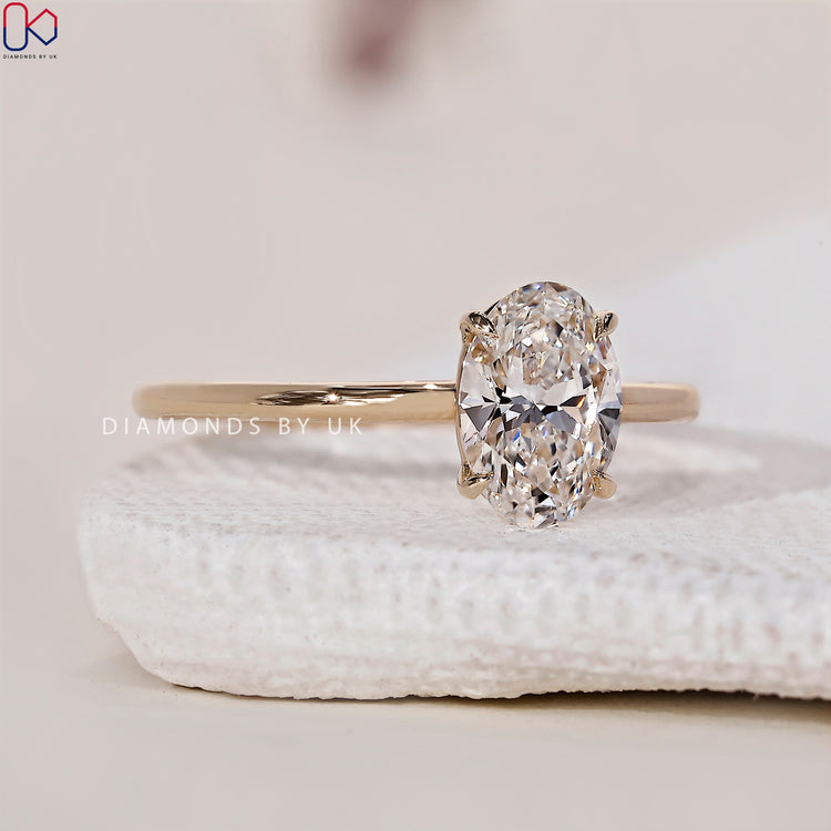 Simple and timeless solitaire ring with an oval shaped engagement ring.
