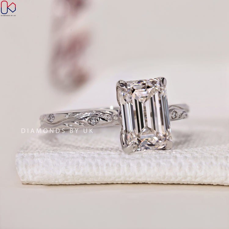 Art Deco Engagement Ring with Emerald Cut and tulip setting, beautifully designed for timeless elegance.
