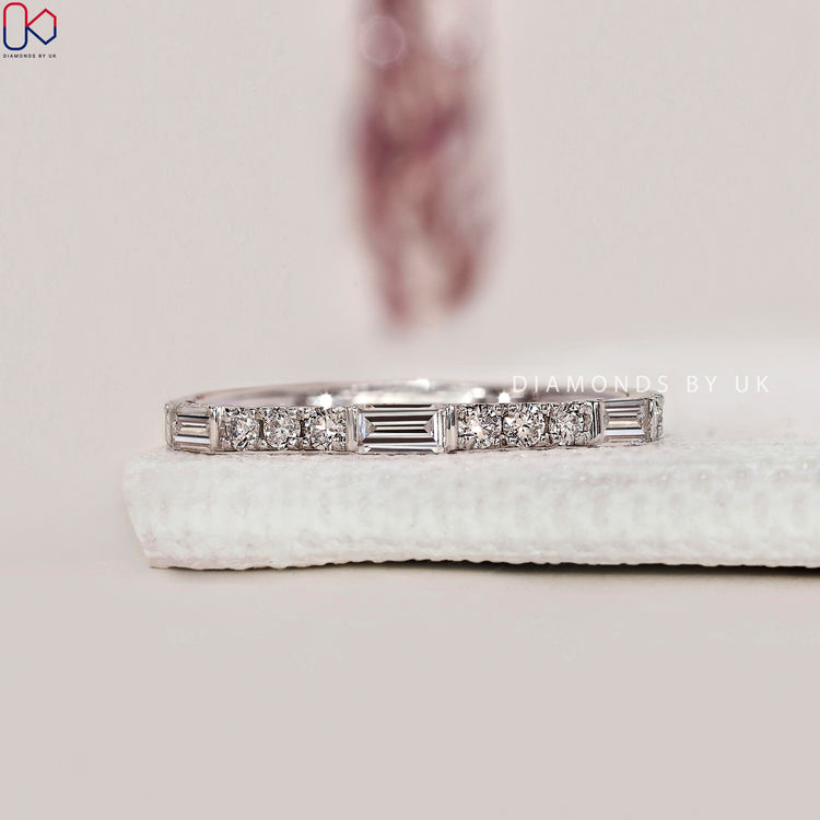 Round and baguette diamond band, handmade finish.
