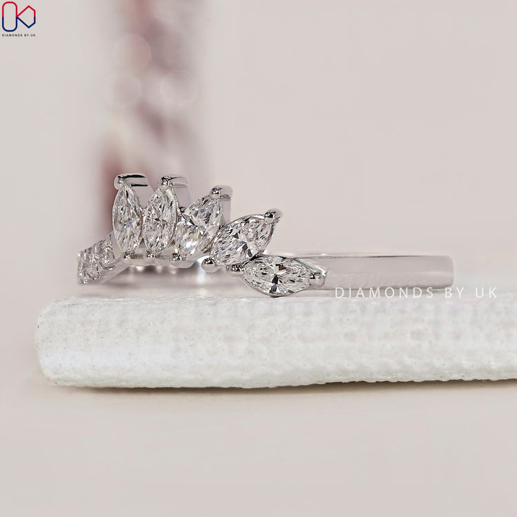 Tiara style white gold wedding band with sparkling round diamonds.

