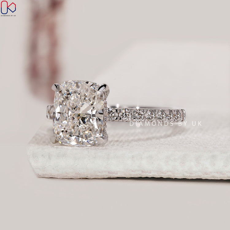 4 claw prong setting on hidden halo ring.
