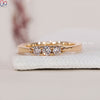 Yellow gold wedding band with three lab grown diamonds.
