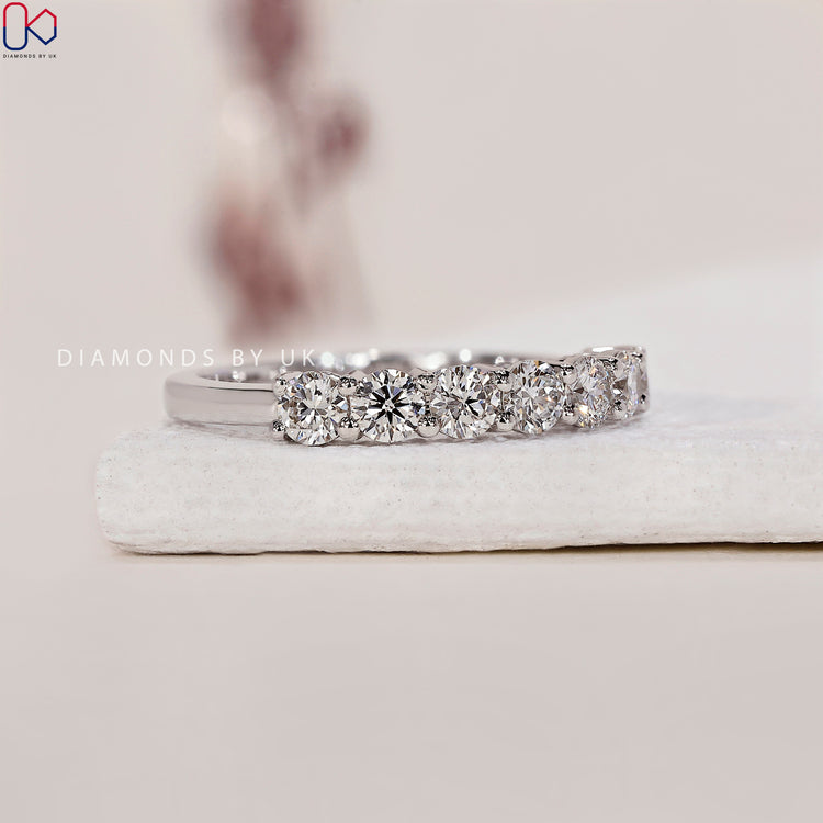 Prong setting band with lab created diamonds for a secure fit.
