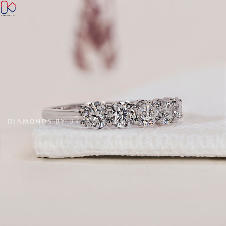 Diamondsbyuk wedding band with IGI certified stones and intricate craftsmanship.
