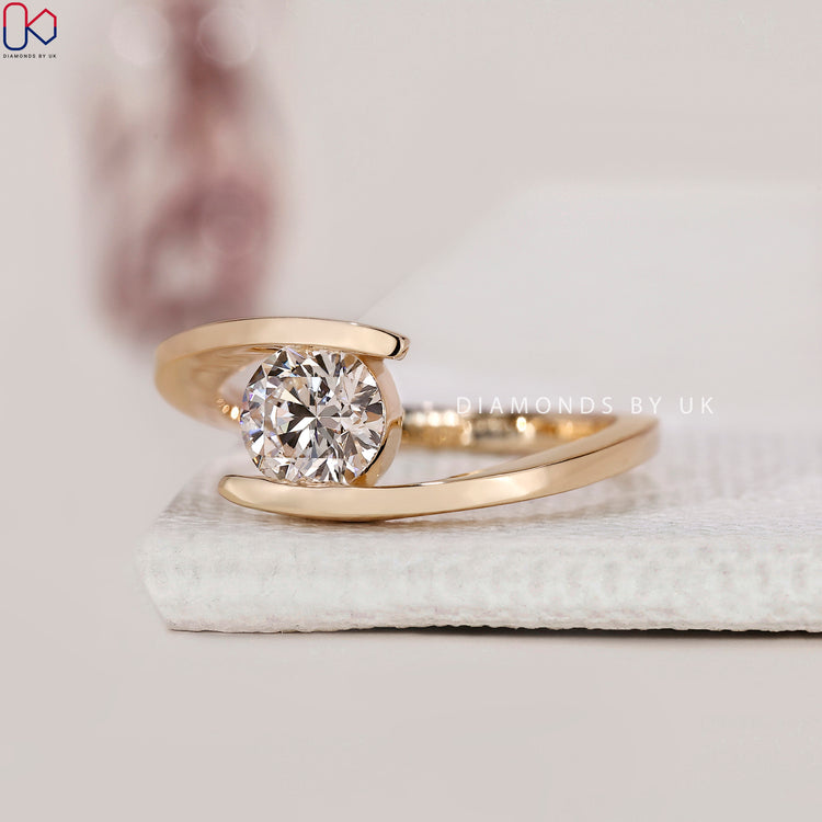 Yellow gold ring crafted with a handmade round lab grown diamond centre.
