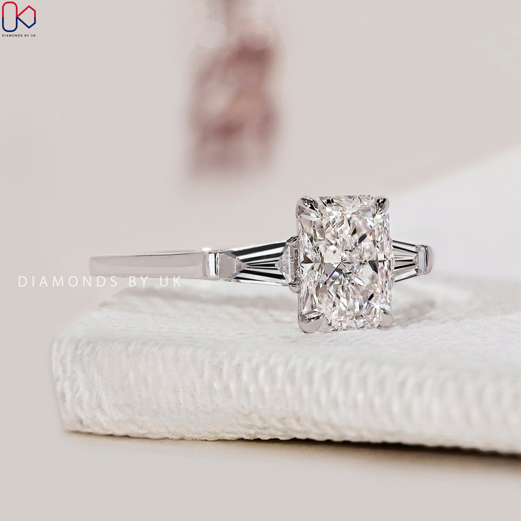 Side Stone Engagement Ring with brilliant diamonds on either side.
