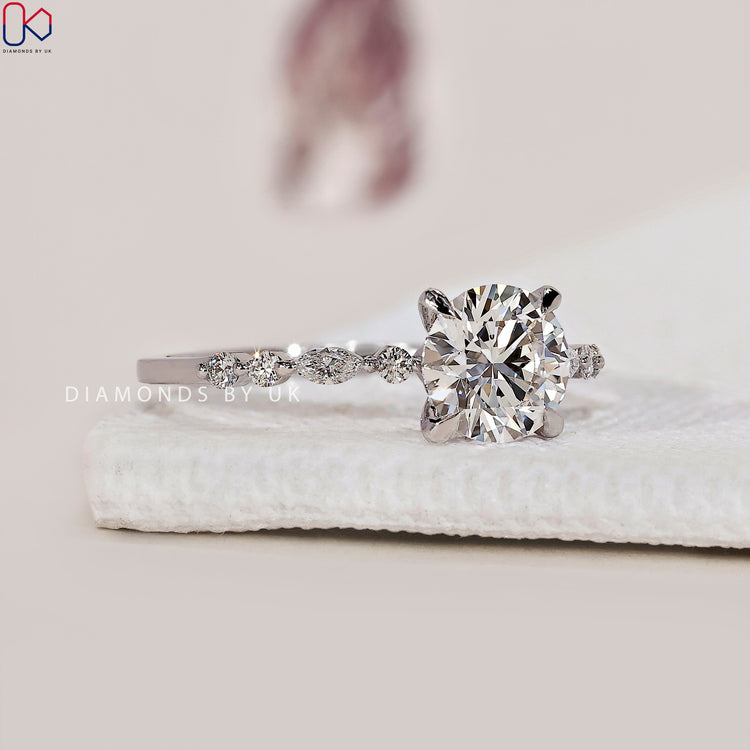 White gold diamond ring with a 4-prong claw setting.
