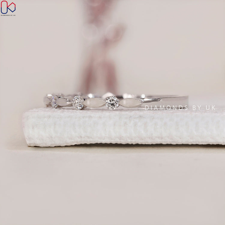 Distance pave band with intricate detailing and a sophisticated look.
