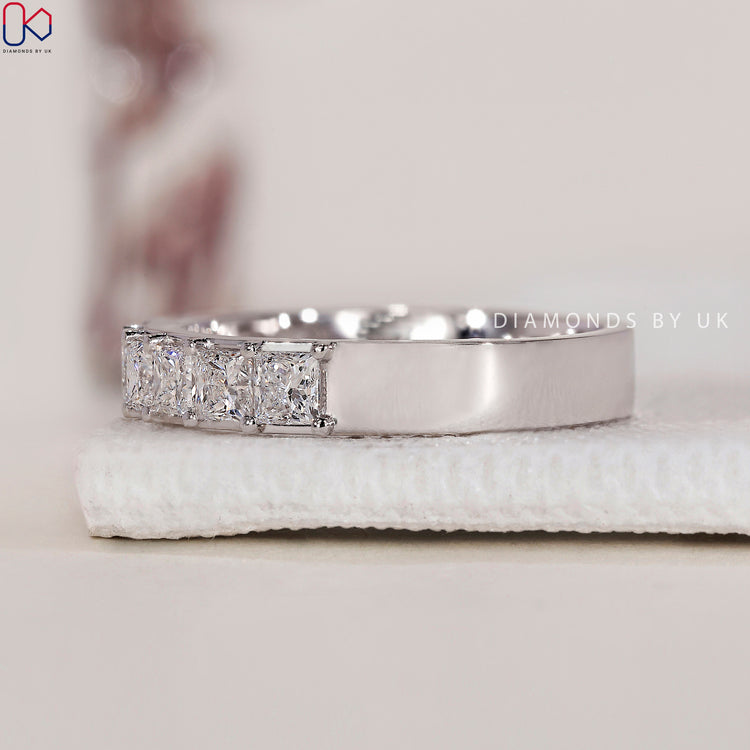 Handmade jewelry with a princess cut eternity band for a unique style.
