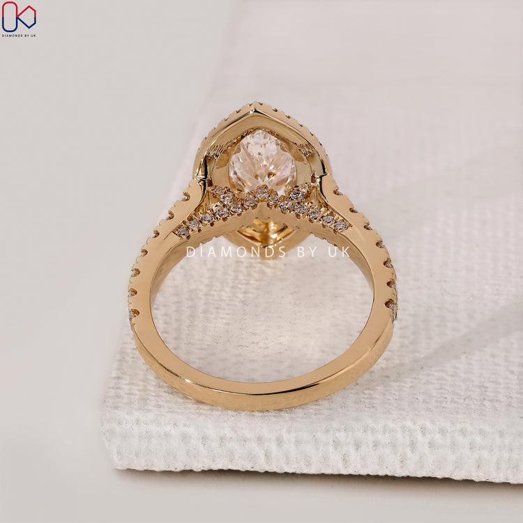 Lab-grown diamond engagement ring with pave accents.
