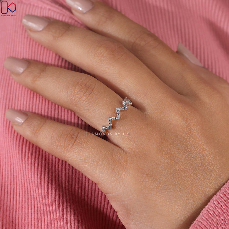 Dainty diamond wedding band featuring lab grown diamonds.
