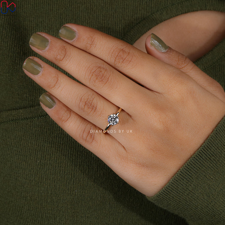 Solitaire engagement ring with 6 claw prong setting.
