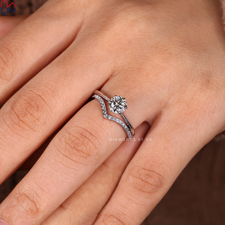 Buy bridal set with solitaire setting ring and curved diamond wedding band.
