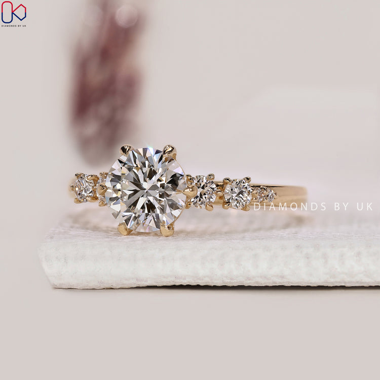 Round side diamonds paired with round cut center.
