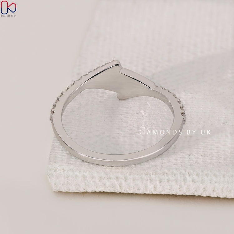 Handmade jewellery featuring a unique bypass wedding band design.
