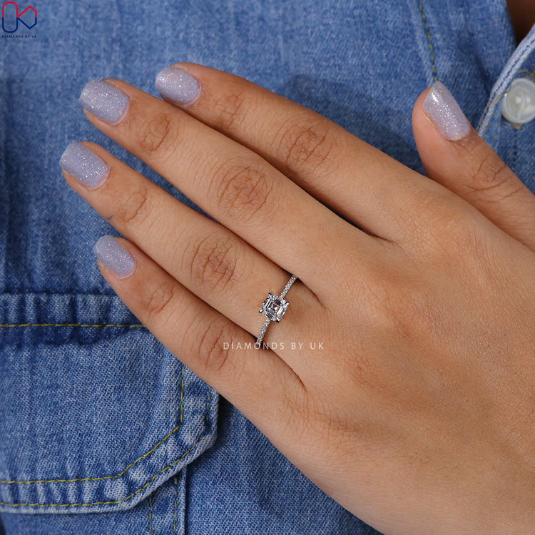 4 prong Asscher diamond ring with pave setting.