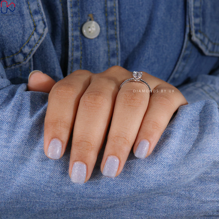 DiamondsbyUK Asscher cut engagement ring in white gold.