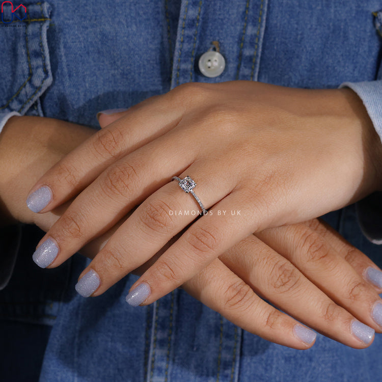 Asscher diamond ring in prong setting with pave band.