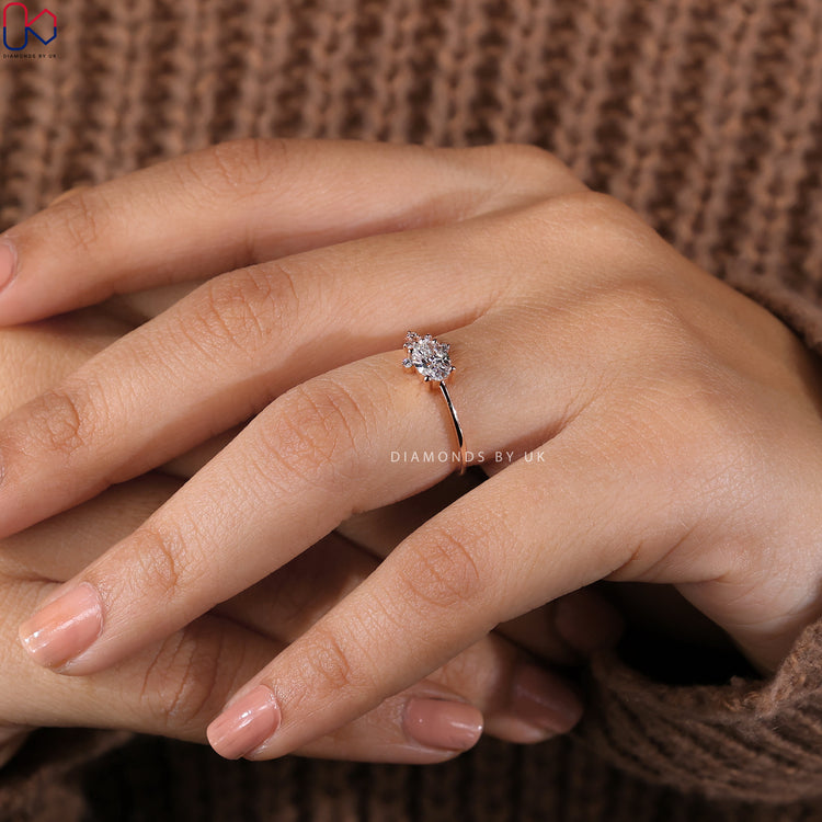 Engagement ring UK with an exquisite oval diamond setting.
