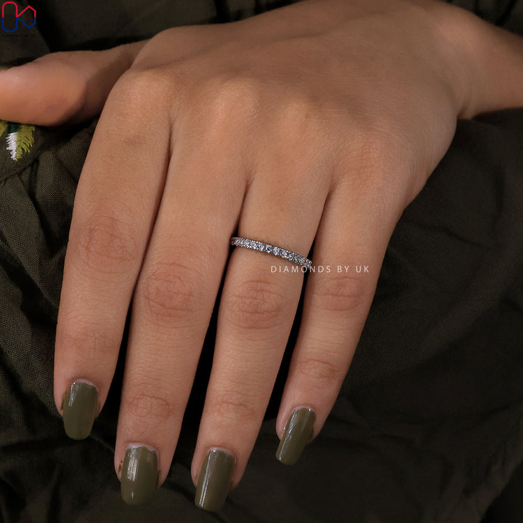 Dainty half eternity band made with lab created diamonds.
