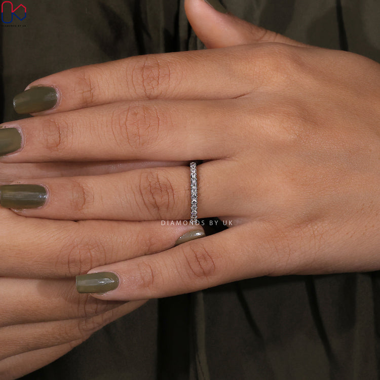 Half eternity diamond band crafted in white gold.

