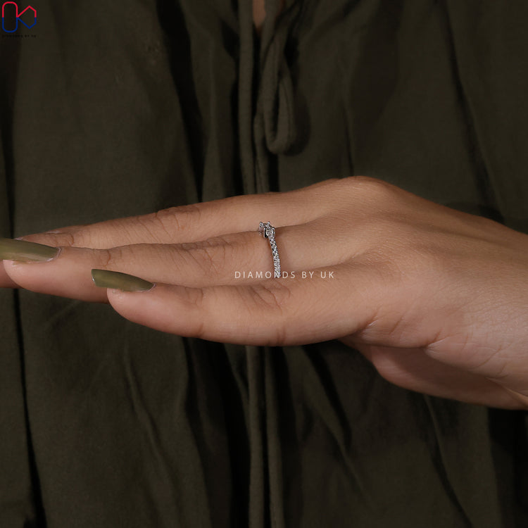 Lab grown diamond band with baguette centre stone in a classic design.
