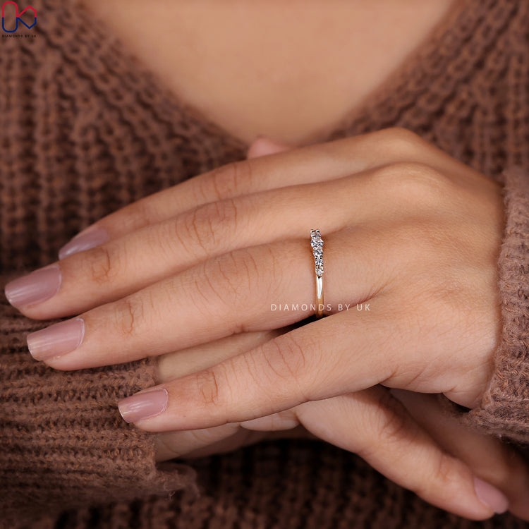 Handmade band featuring round diamonds and gold finish.
