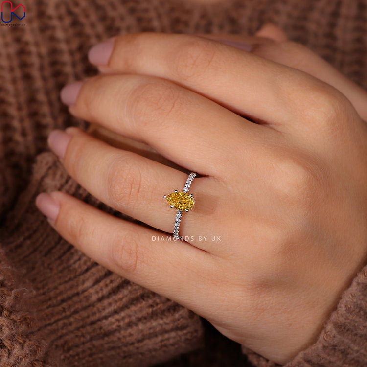 Pear Shaped Ring set with dazzling yellow diamonds for elegance.
