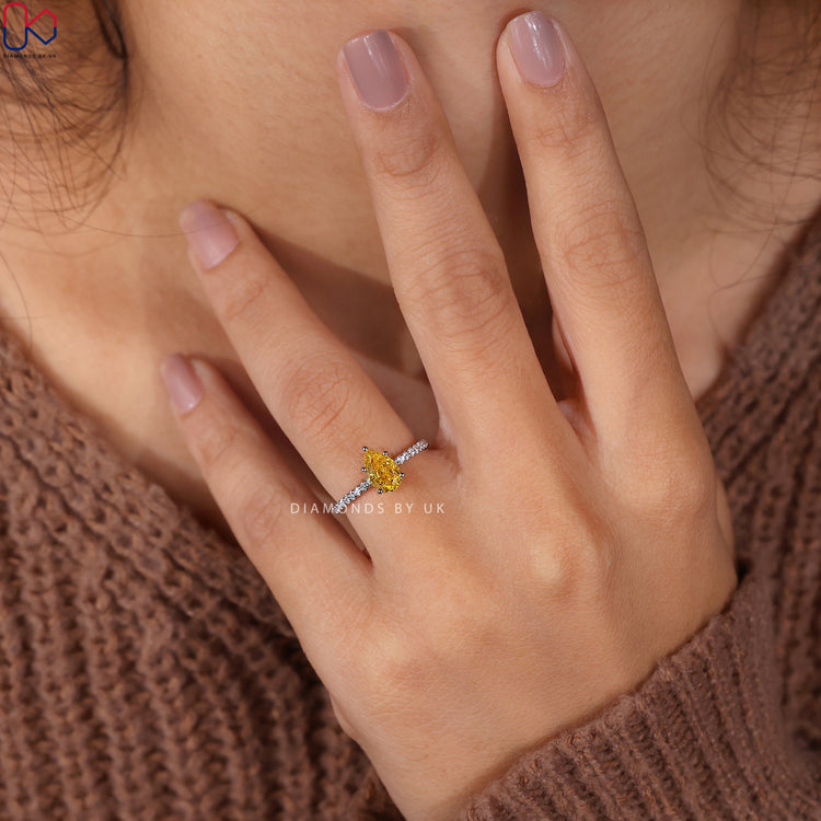 Buy Engagement Ring with stunning yellow diamonds and elegant design.