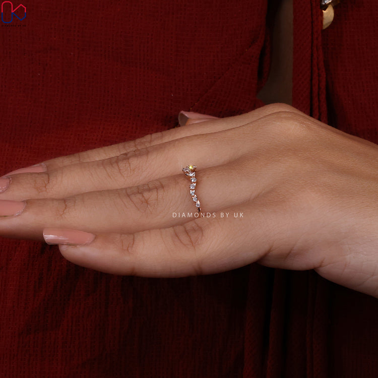 Half eternity wedding band with round diamonds set in rose gold.
