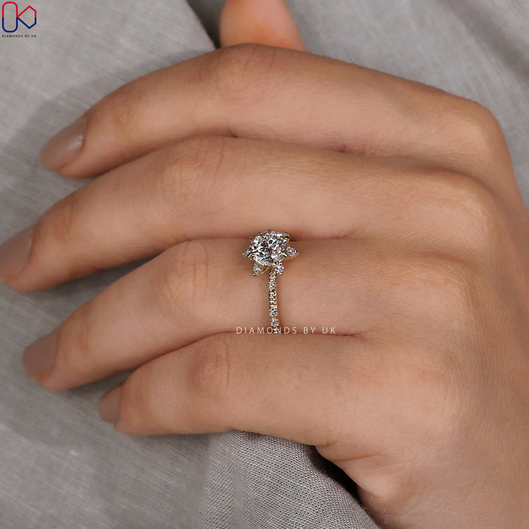 Handmade jewellery featuring a round diamond engagement ring in white gold.

