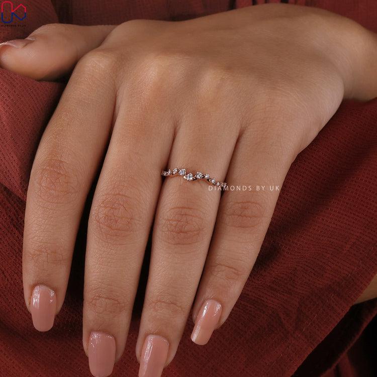 Lab grown diamond band with a half eternity design in rose gold.
