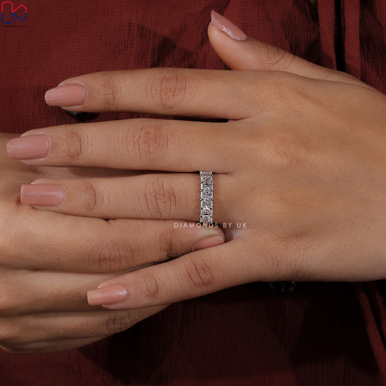 Customise your wedding band with radiant cut diamonds in claw prongs.

