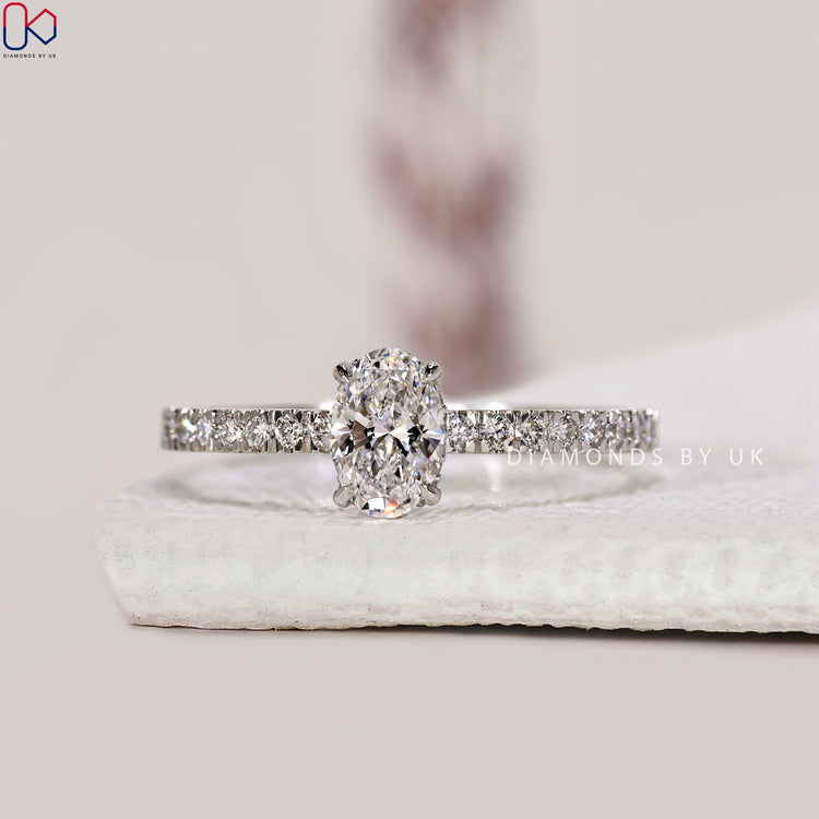 Handmade oval diamond ring with 4 claw prong setting.