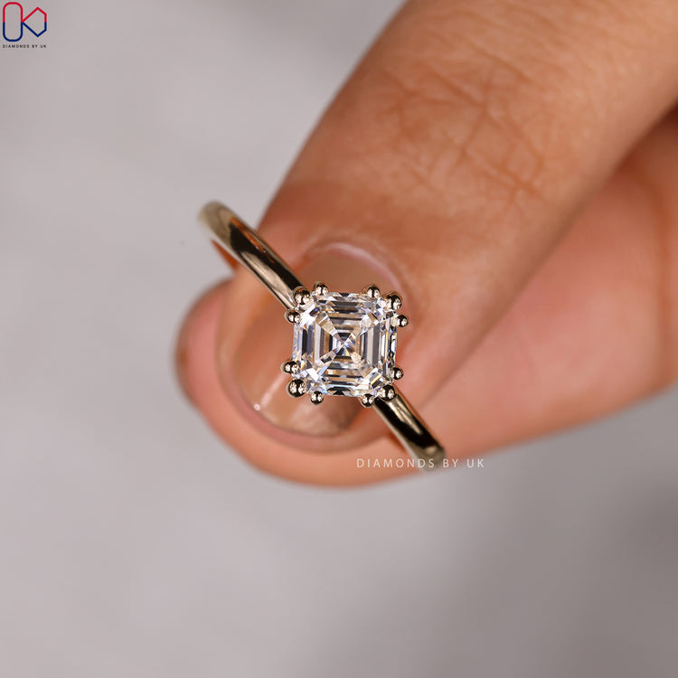Solitaire setting asscher cut engagement ring from Diamondsbyuk.

