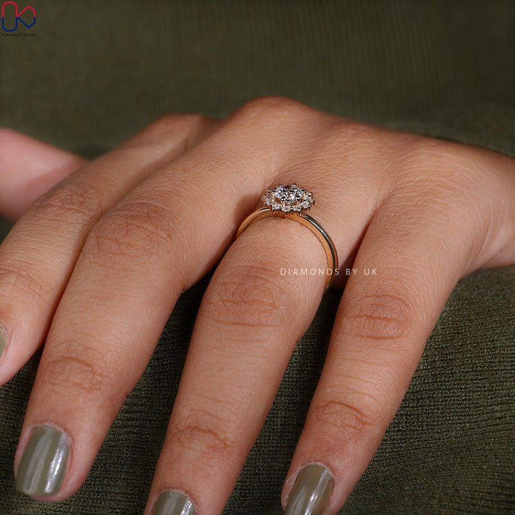 Prong set round cut diamond ring with halo frame.
