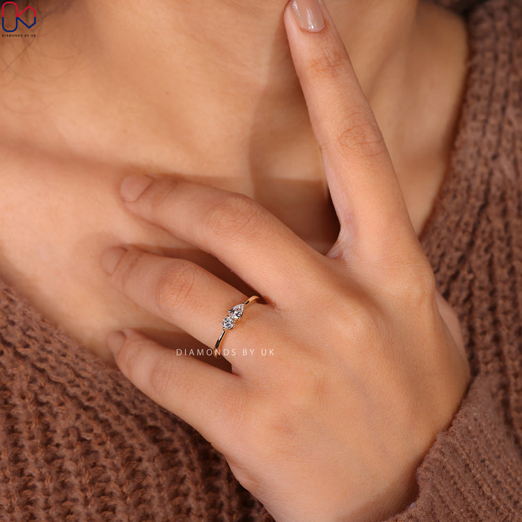 Pear and round diamond ring in a stunning two-stone design.
